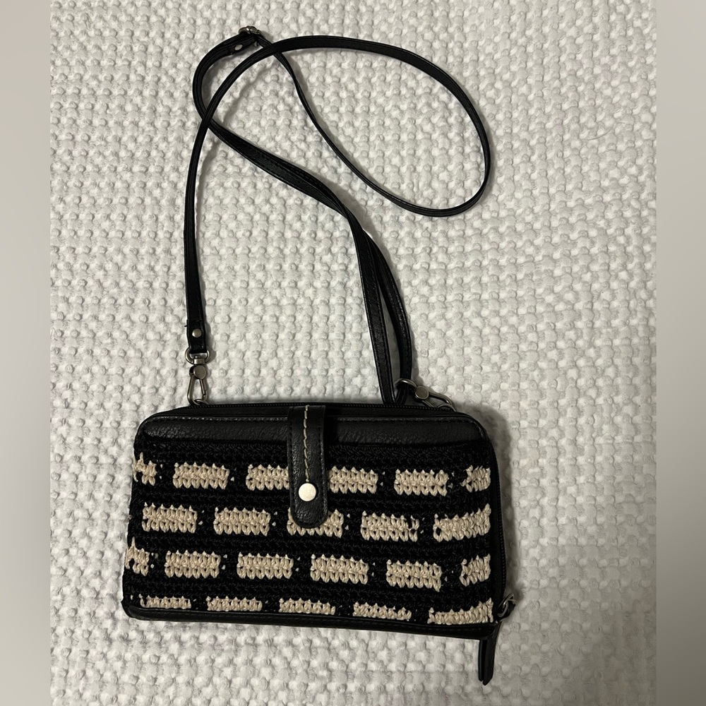 Black and cream colored Sak crossbody